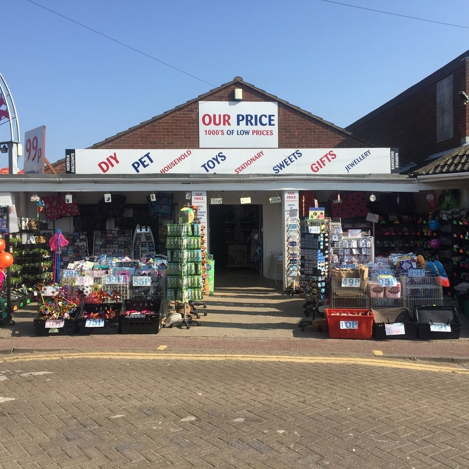 Our Price shopfront with its red and navy sign and displays outside
